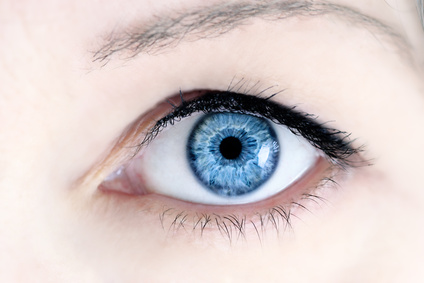 Macro of a woman's beautiful blue eyes. Extreme shallow depth of field with selective focus on center of eye.